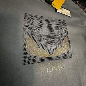 Fendi grey T-shirt brand new. Size XXXL though I’d say more of a tight fit XL.